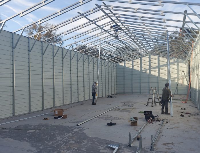 Energy-efficient metal barn with sliding doors